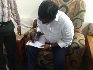 MLA Puvvada Ajay Kumar extending his support by signing the document